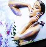 Ariana Grande thrilling topless album