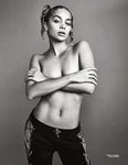 Jasmine Sanders poses topless and shows off butt