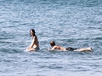 Jennifer Lawrence on the beach in a wet swimsuit