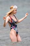 Nicola Peltz in a wet swimsuit
