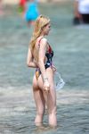 Nicola Peltz in a wet swimsuit