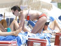 Katie Cassidy in a wet swimsuit