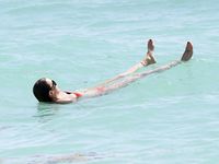 Katie Cassidy in a wet swimsuit