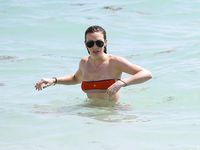 Katie Cassidy in a wet swimsuit
