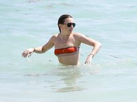 Katie Cassidy in a wet swimsuit