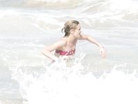 Kirsten Dunst in a wet swimsuit