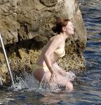 Kirsten Dunst in a wet swimsuit