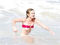 Kirsten Dunst in a wet swimsuit