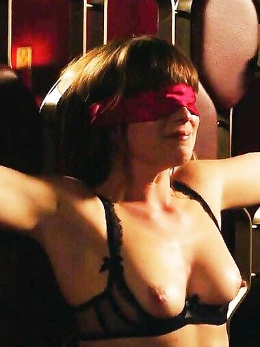 Dakota Johnson showing her breasts and bush